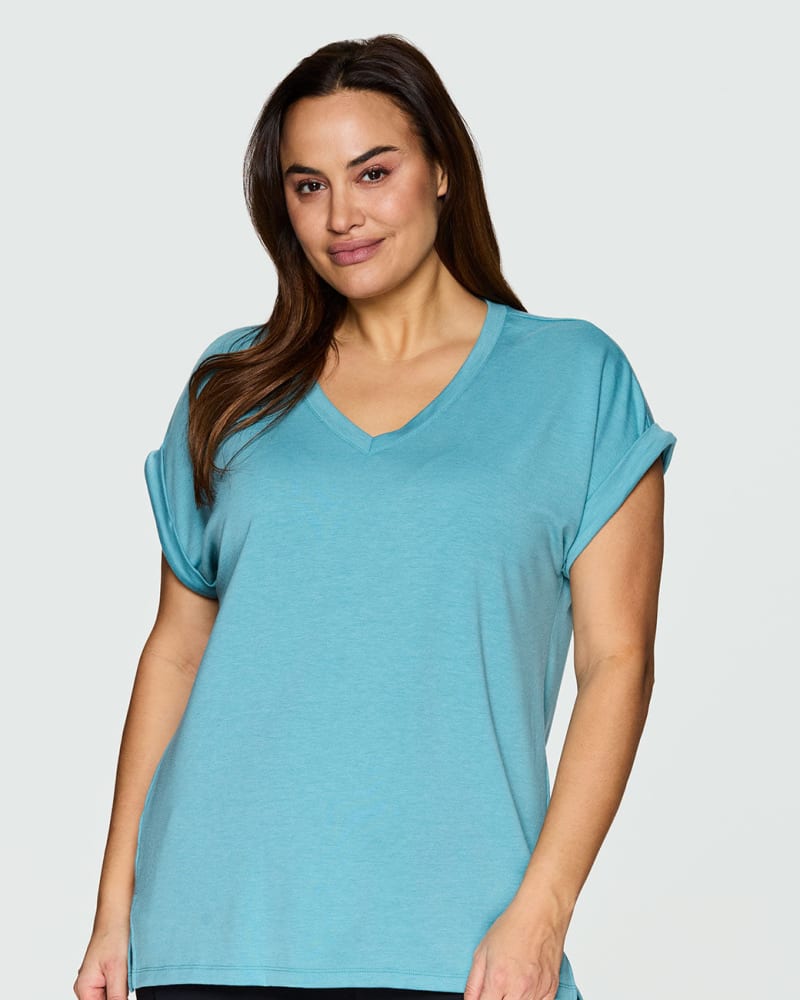 Front of a model wearing a size 1X Everyday V-neck Tunic in Teal by RBX Active. | dia_product_style_image_id:244600